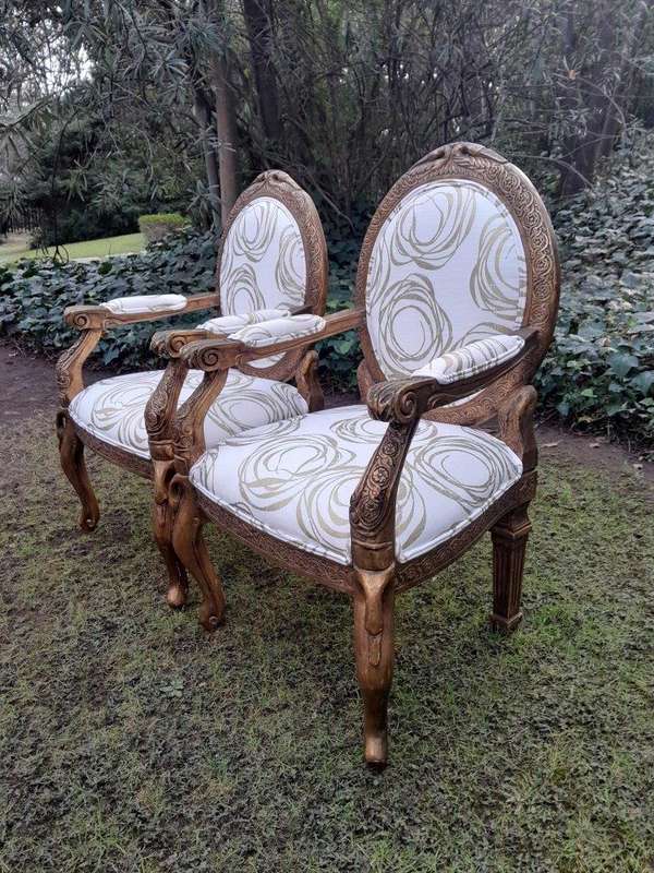 A Pair of 20th Century Style Gilt Arm Chairs