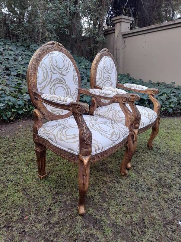 A Pair of 20th Century Style Gilt Arm Chairs