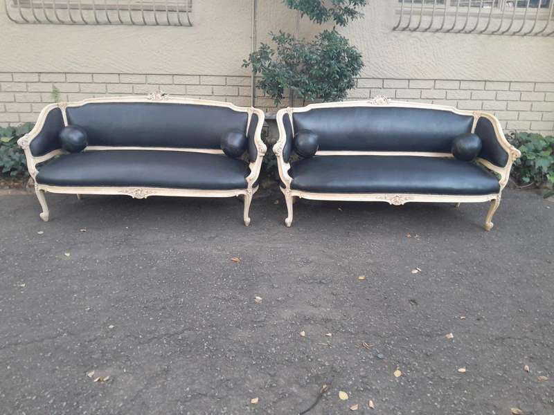A 20th Century Pair of French Style Carved Walnut Settees in a Contemporary Bleached Finish and U...