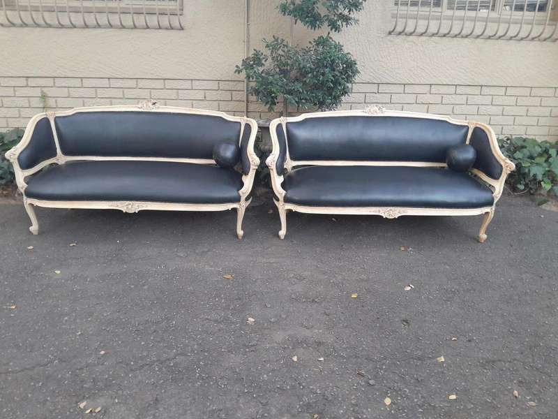 A 20th Century Pair of French Style Carved Walnut Settees in a Contemporary Bleached Finish and U...