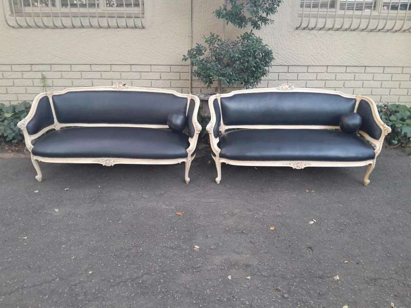 A 20th Century Pair of French Style Carved Walnut Settees in a Contemporary Bleached Finish and U...