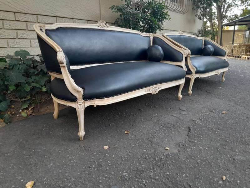 A 20th Century Pair of French Style Carved Walnut Settees in a Contemporary Bleached Finish and U...