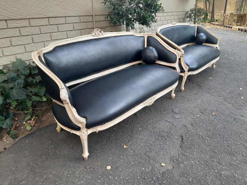 A 20th Century Pair of French Style Carved Walnut Settees in a Contemporary Bleached Finish and U...