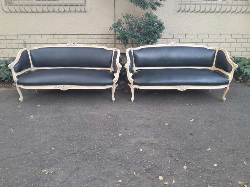A 20th Century Pair of French Style Carved Walnut Settees in a Contemporary Bleached Finish and U...