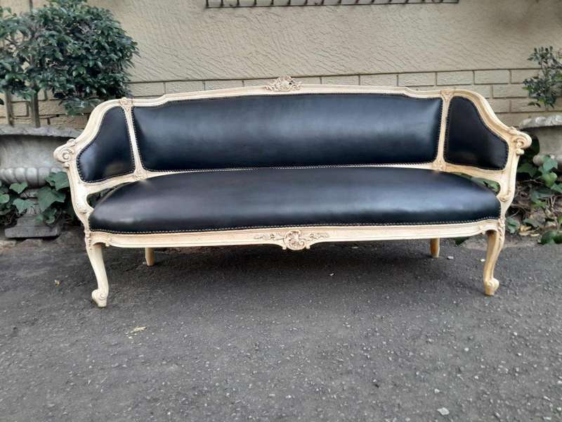 A 20th Century Pair of French Style Carved Walnut Settees in a Contemporary Bleached Finish and U...