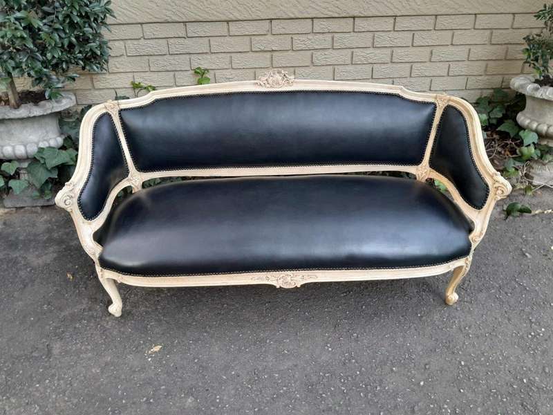 A 20th Century Pair of French Style Carved Walnut Settees in a Contemporary Bleached Finish and U...
