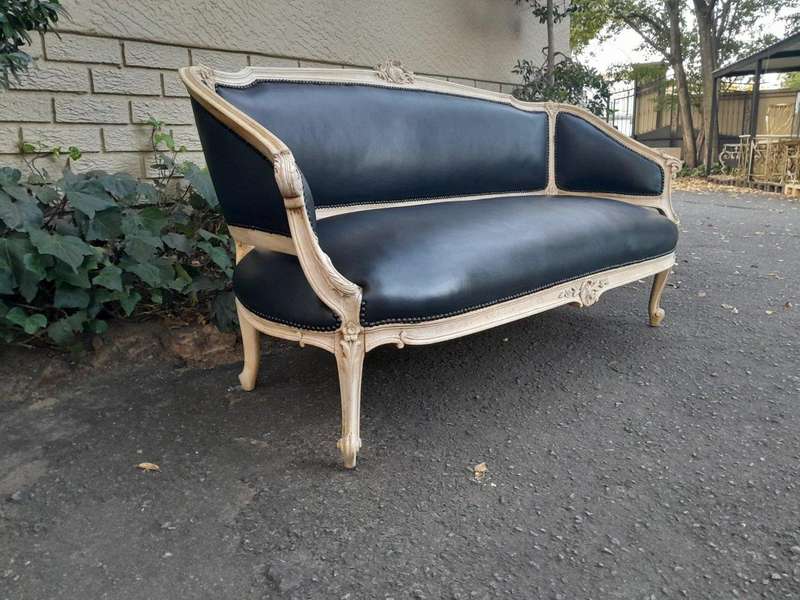 A 20th Century Pair of French Style Carved Walnut Settees in a Contemporary Bleached Finish and U...