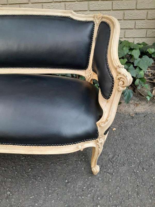 A 20th Century Pair of French Style Carved Walnut Settees in a Contemporary Bleached Finish and U...