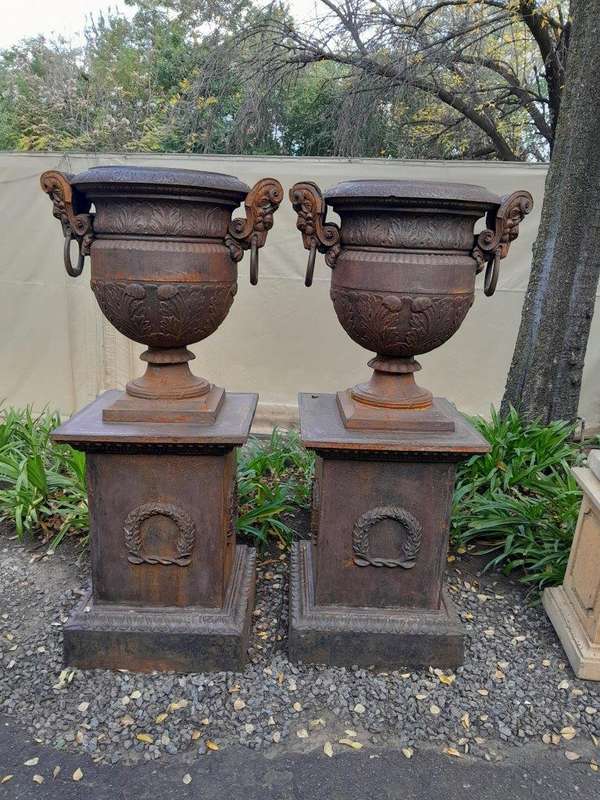 A 20TH Century Pair of French Cast Iron Urns / Planters on Plinths of Large Proportions