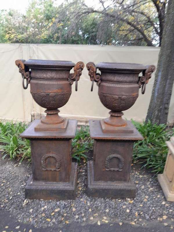 A 20TH Century Pair of French Cast Iron Urns / Planters on Plinths of Large Proportions