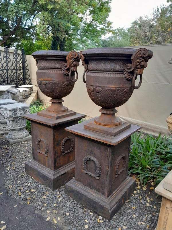 A 20TH Century Pair of French Cast Iron Urns / Planters on Plinths of Large Proportions