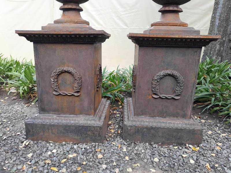 A 20TH Century Pair of French Cast Iron Urns / Planters on Plinths of Large Proportions