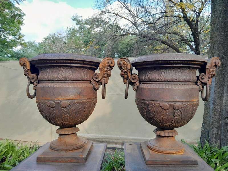 A 20TH Century Pair of French Cast Iron Urns / Planters on Plinths of Large Proportions
