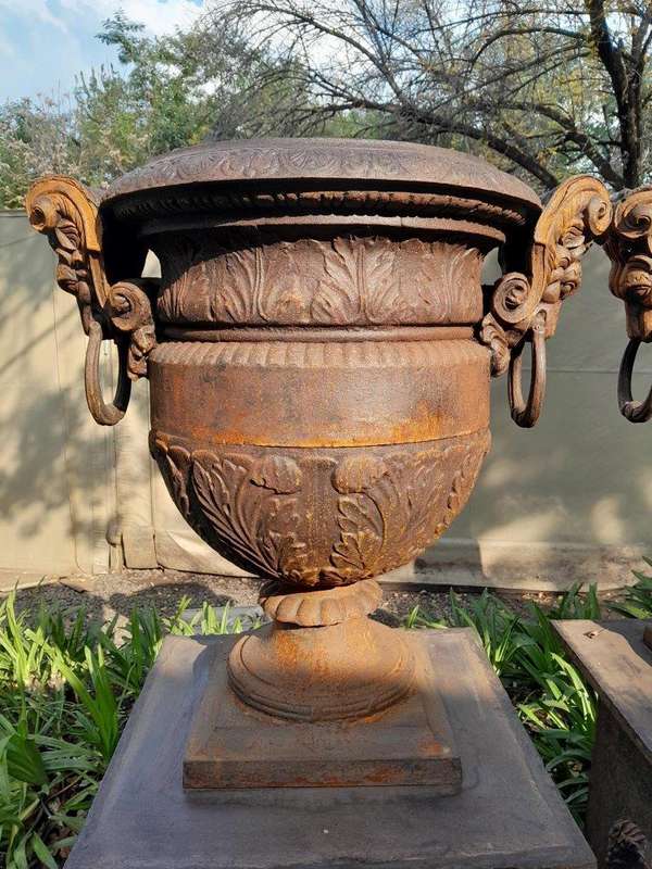 A 20TH Century Pair of French Cast Iron Urns / Planters on Plinths of Large Proportions