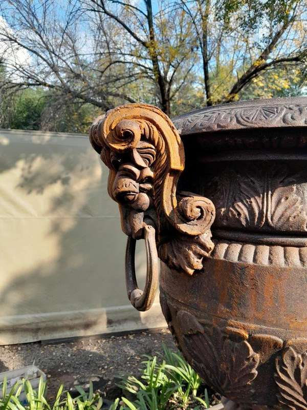 A 20TH Century Pair of French Cast Iron Urns / Planters on Plinths of Large Proportions