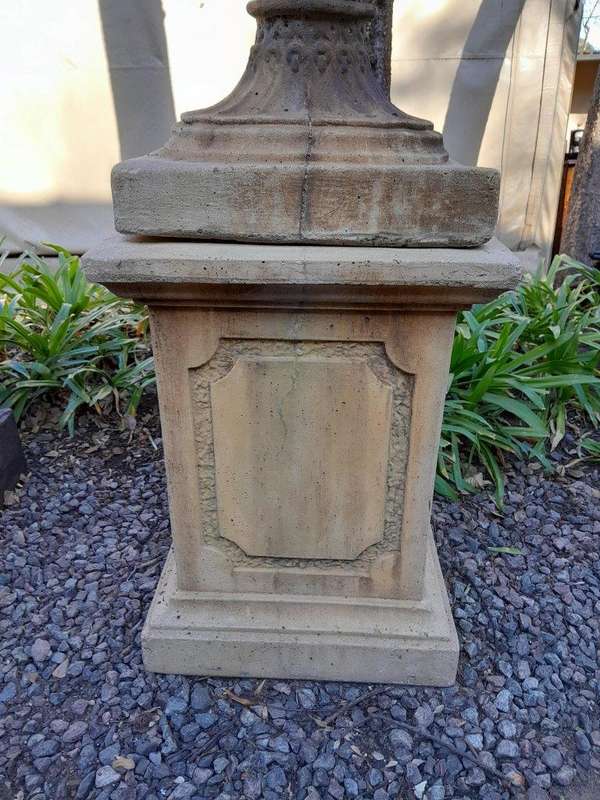 A 20th Century Pair of Large Decorative Concrete Urns with Lids on Plinths