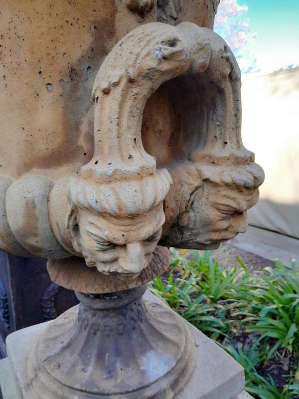 A 20th Century Pair of Large Decorative Concrete Urns with Lids on Plinths