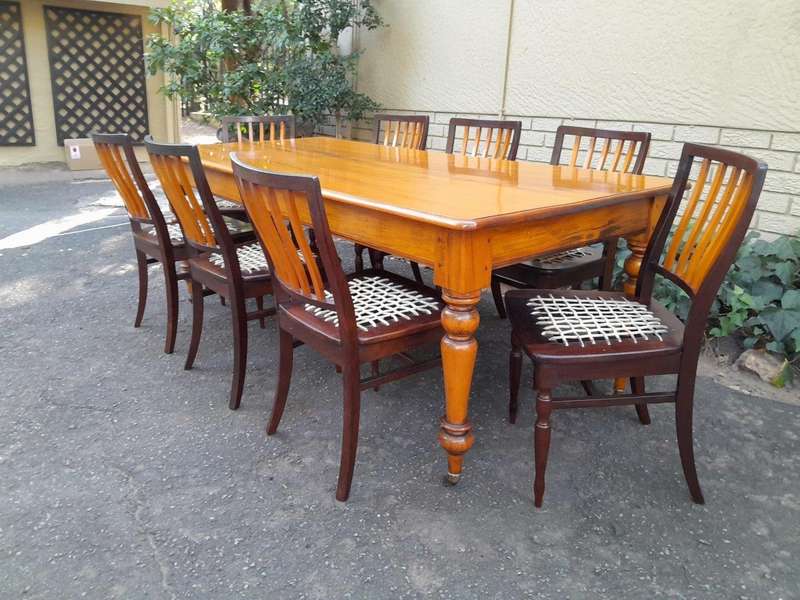 A Late 19thCentury  Early 20th Century Yellowwood Dining Table  with A 20th Century Set of Eigh...