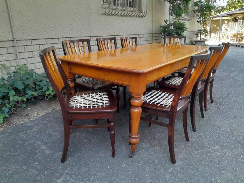 A Late 19thCentury  Early 20th Century Yellowwood Dining Table  with A 20th Century Set of Eigh...