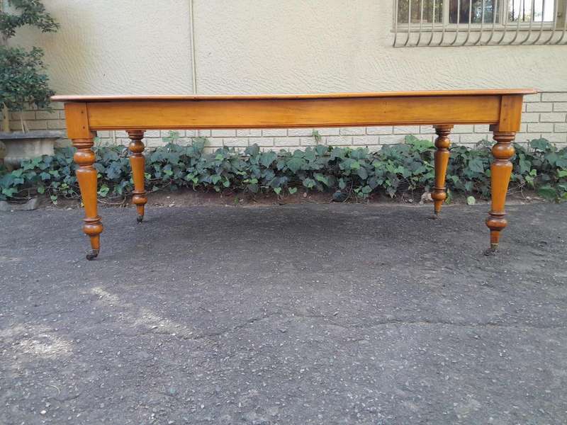 A Late 19thCentury  Early 20th Century Yellowwood Dining Table  with A 20th Century Set of Eigh...
