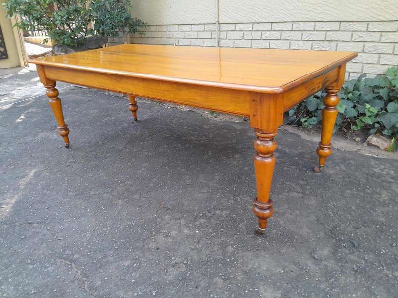 A Late 19thCentury  Early 20th Century Yellowwood Dining Table  with A 20th Century Set of Eigh...