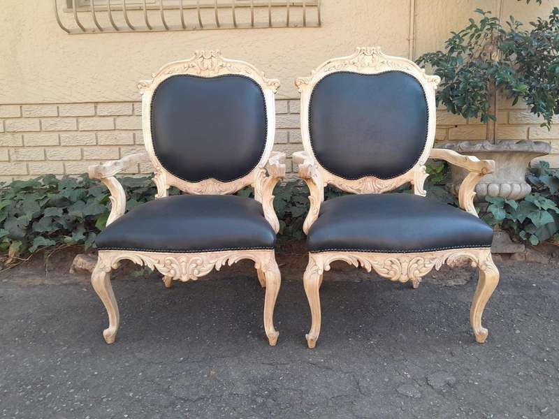 A 20th Century Pair Of French Style Carved Oak Armchairs In A Contemporary Bleached Finish And Up...