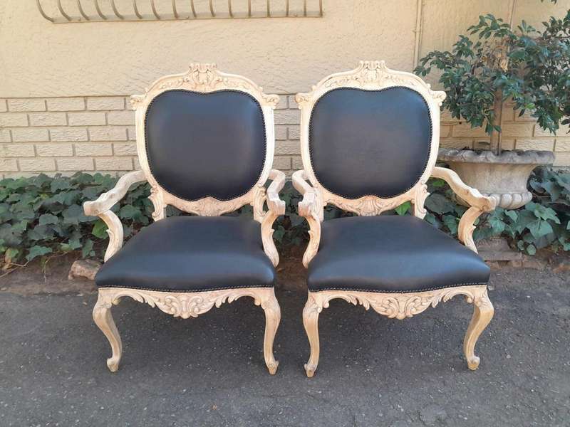 A 20th Century Pair Of French Style Carved Oak Armchairs In A Contemporary Bleached Finish And Up...