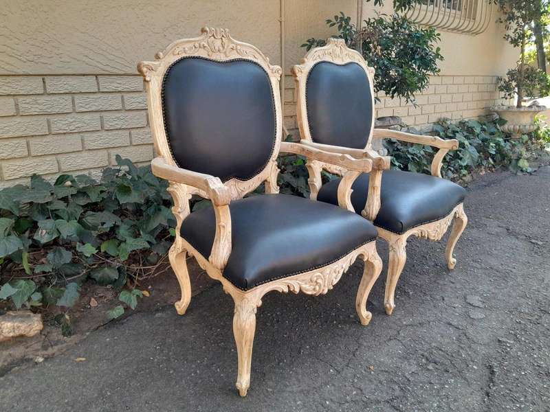 A 20th Century Pair Of French Style Carved Oak Armchairs In A Contemporary Bleached Finish And Up...