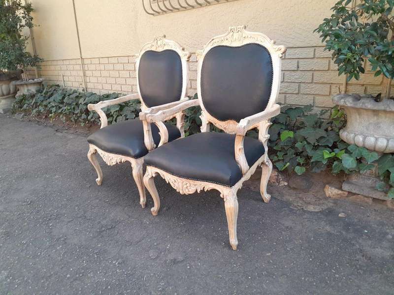 A 20th Century Pair Of French Style Carved Oak Armchairs In A Contemporary Bleached Finish And Up...