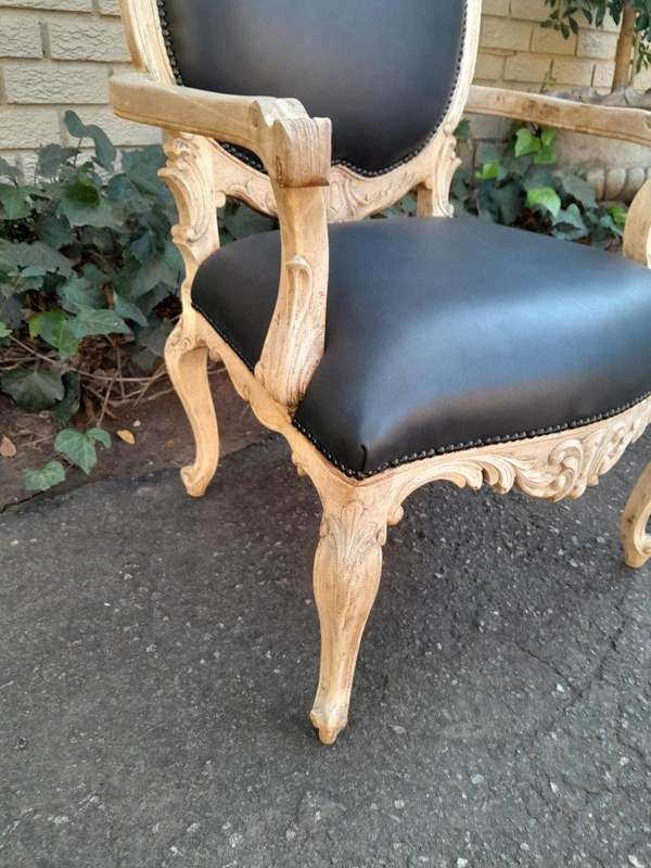 A 20th Century Pair Of French Style Carved Oak Armchairs In A Contemporary Bleached Finish And Up...