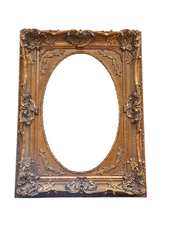 A 20th Century French Style Ornately Carved Bevelled and Gilt Wood Mirror