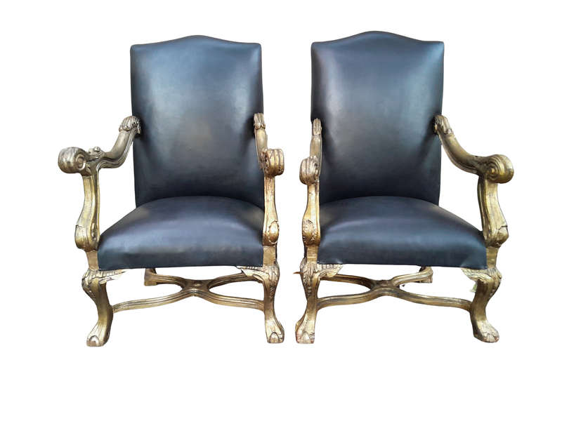 A 20th Century French Style Ornately Carved Pair Of Arm Chairs Hand Gilded And Upholstered In A D...