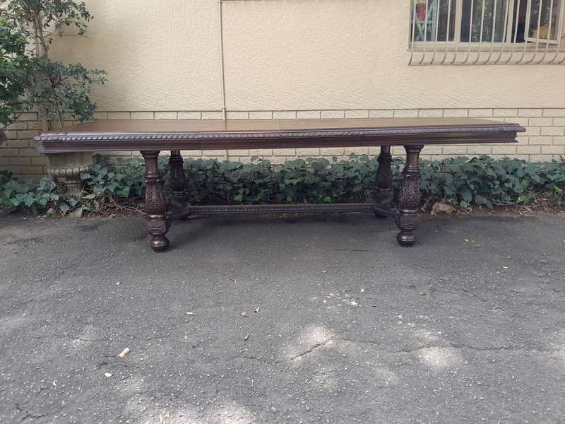 A 20th Century Carved Rosewood Dining / Refectory / Entrance Table With Two Extending Leaves