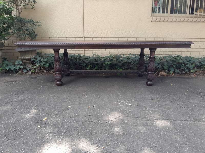 A 20th Century Carved Rosewood Dining / Refectory / Entrance Table With Two Extending Leaves