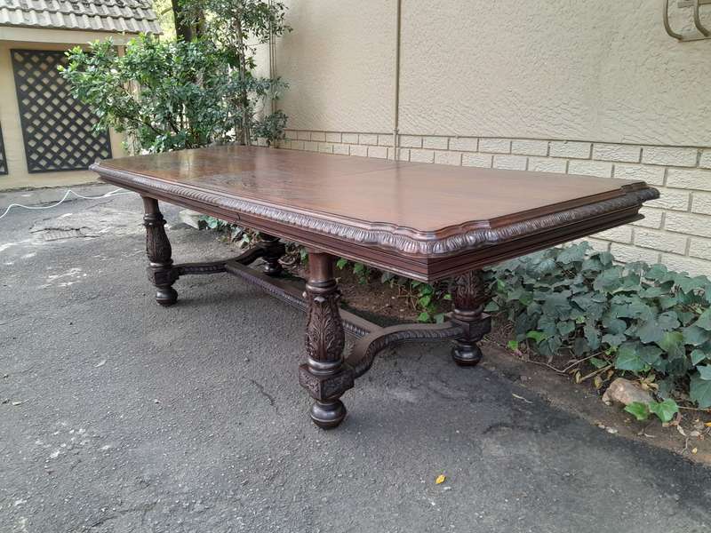 A 20th Century Carved Rosewood Dining / Refectory / Entrance Table With Two Extending Leaves