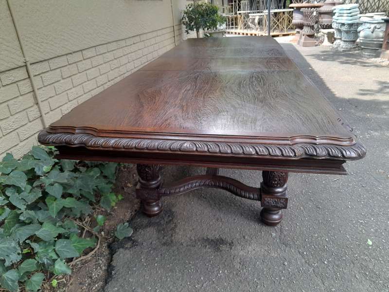 A 20th Century Carved Rosewood Dining / Refectory / Entrance Table With Two Extending Leaves
