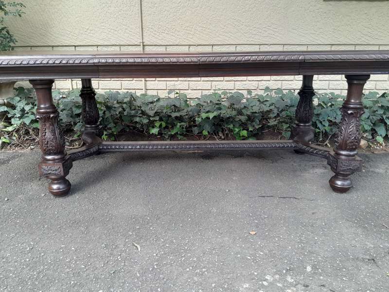 A 20th Century Carved Rosewood Dining / Refectory / Entrance Table With Two Extending Leaves
