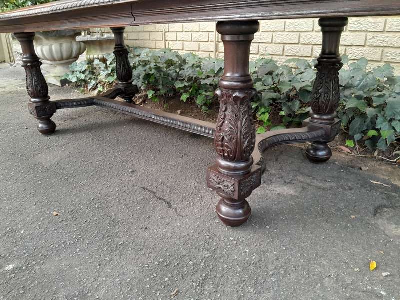 A 20th Century Carved Rosewood Dining / Refectory / Entrance Table With Two Extending Leaves