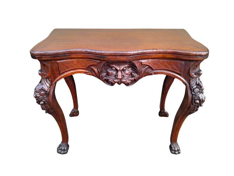 An Antique Jacobean Ornately Carved Oak Card Table with Black Baize