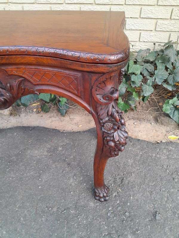 An Antique Jacobean Ornately Carved Oak Card Table with Black Baize