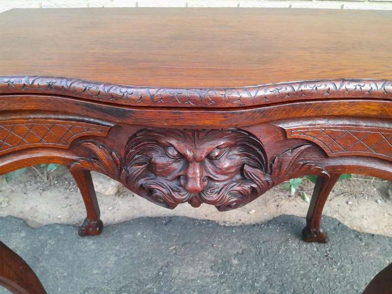 An Antique Jacobean Ornately Carved Oak Card Table with Black Baize