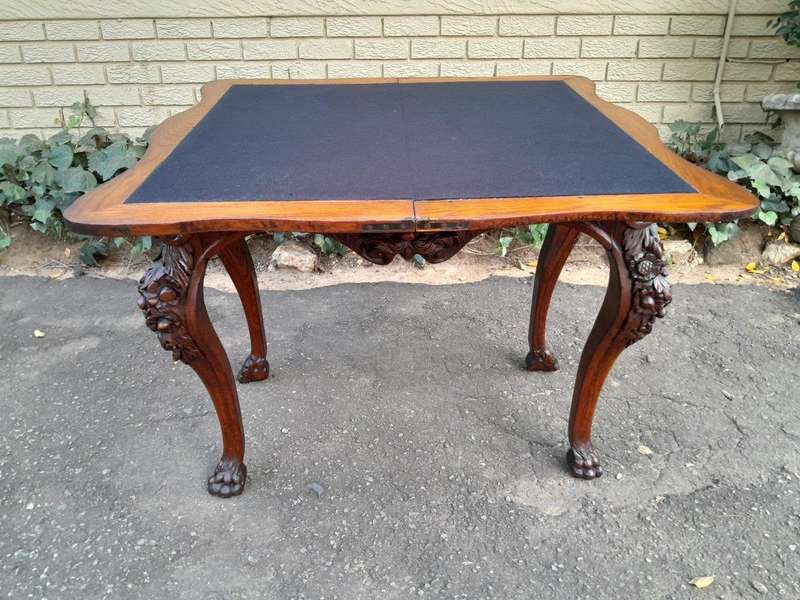 An Antique Jacobean Ornately Carved Oak Card Table with Black Baize