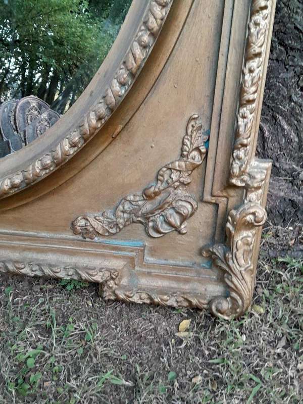 A French Rococo Style Ornately Carved and Gilded Bevelled Mirror