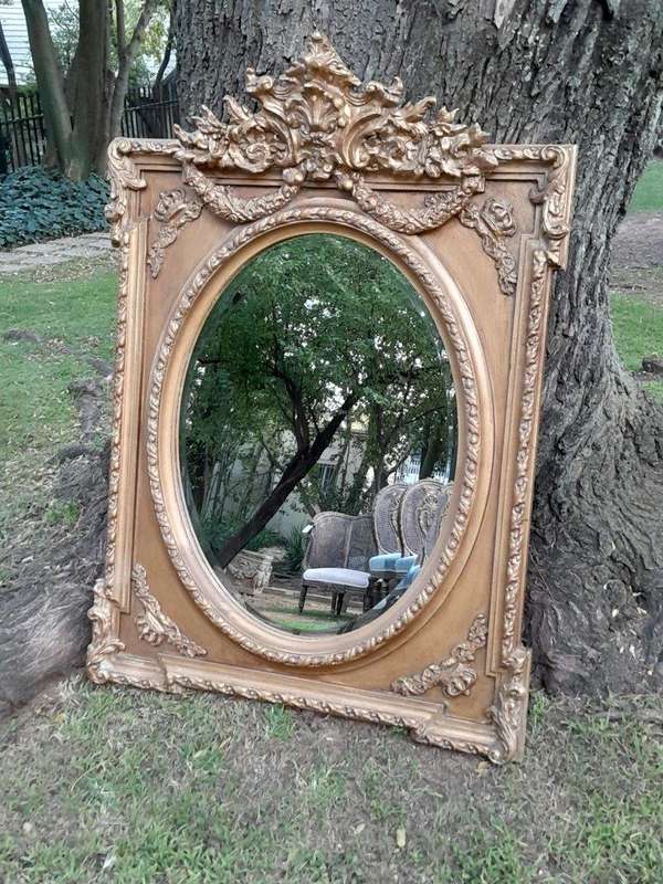 A French Rococo Style Ornately Carved and Gilded Bevelled Mirror