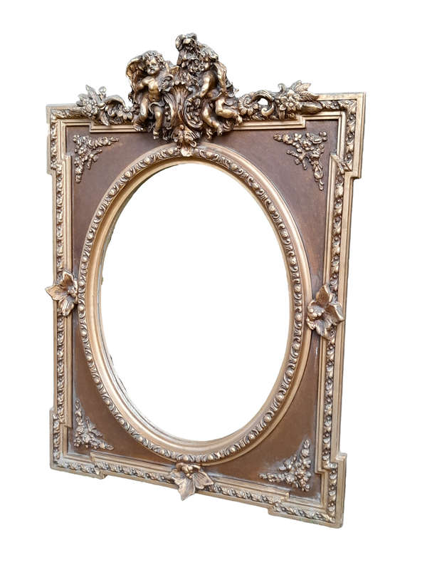 A French Rococo Style Ornately Carved and Gilded Bevelled Mirror