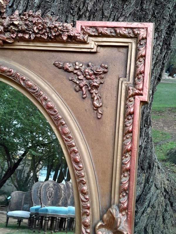 A French Rococo Style Ornately Carved and Gilded Bevelled Mirror