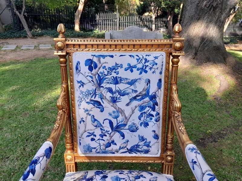 A Pair of French Style Ornately Carved Giltwood Arm Chairs