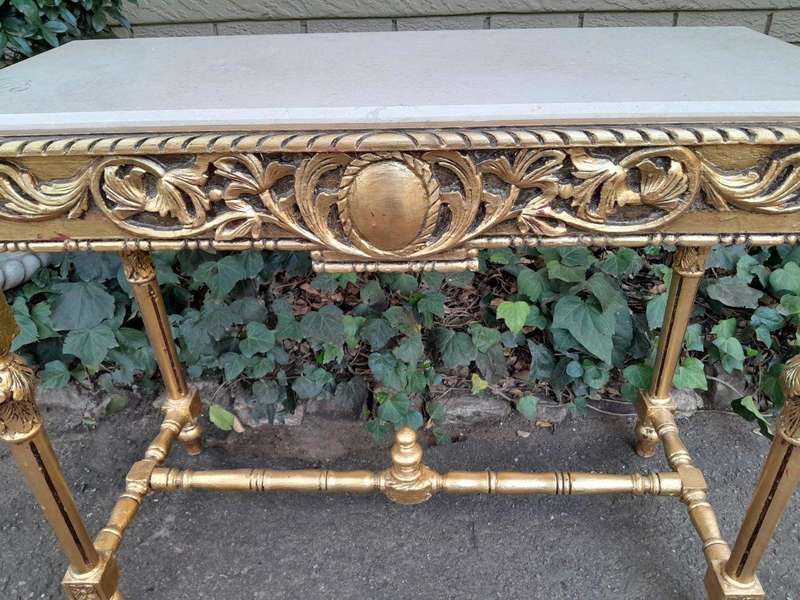A 20th Century Ornately Carved and Hand-Gilded Console Table with Cream Marble Top