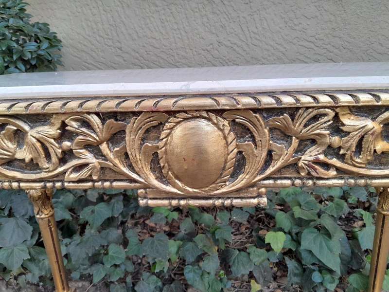 A 20th Century Ornately Carved and Hand-Gilded Console Table with Cream Marble Top