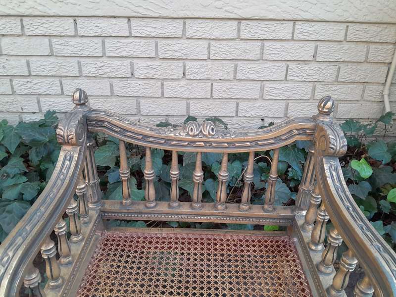 A 20th Century French Style Pair of Ornately Carved and Rattan Arm Chairs